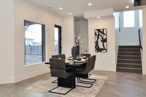 Dining room featuring recessed lighting and finished concrete flooring