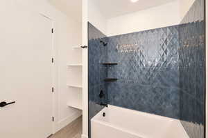 Full bathroom with shower / tub combination