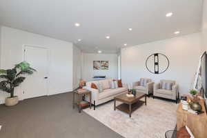 Living area featuring recessed lighting and carpet floors