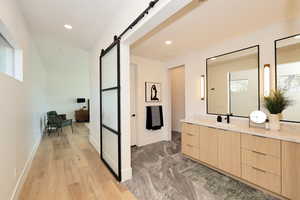 Bathroom featuring vanity and recessed lighting