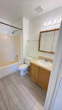 Bathroom featuring vanity and shower / bathtub combination