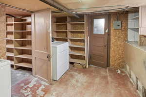 Storage area featuring washer / dryer