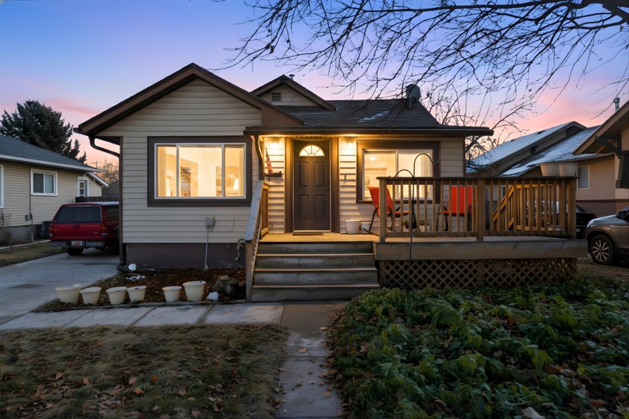 Bungalow-style home featuring a wooden deck