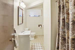 Three quarter bath featuring vanity and a shower with shower curtain