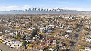 Aerial perspective of suburban area with mountains and property parcel outlined