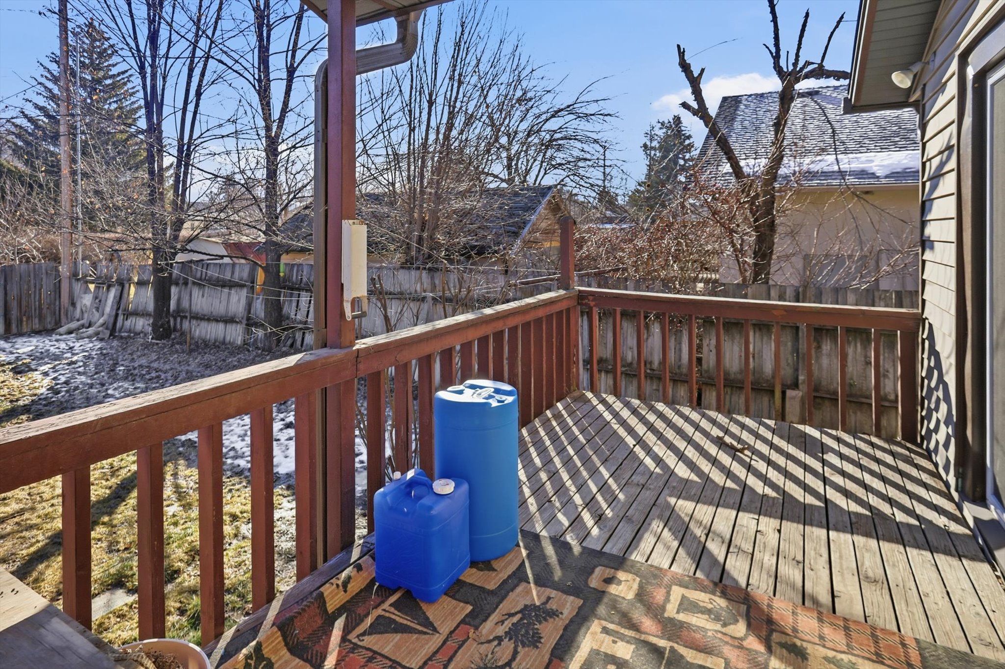 Wooden deck featuring a fenced backyard
