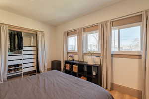 Bedroom featuring baseboards and light wood finished floors
