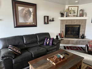Living room with carpet floors and a fireplace