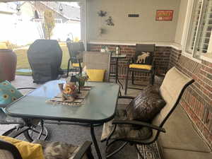 View of patio / terrace featuring outdoor dining space and grilling area