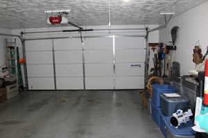 Garage featuring a garage door opener