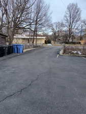 View of asphalt road with a residential view