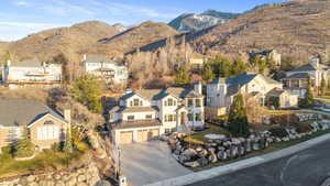 Aerial perspective of suburban area with a mountainous background