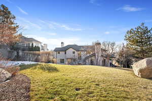 Rear view of house featuring a chimney