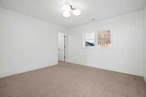 Spare room with carpet flooring and baseboards
