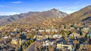 View of mountain backdrop featuring nearby suburban area