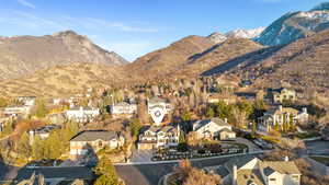 View of mountain backdrop featuring nearby suburban area