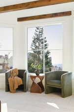 Sitting room with carpet flooring and baseboards