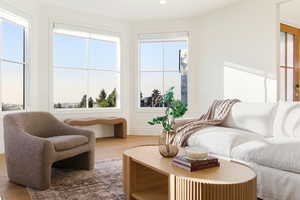 Living room featuring light wood-style flooring and recessed lighting