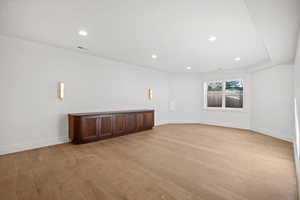 Spare room featuring light wood-style floors and recessed lighting