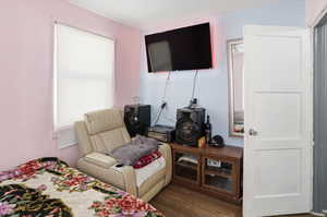 Bedroom featuring dark wood finished floors