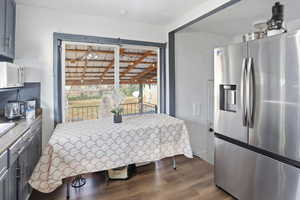 Dining space with dark wood finished floors