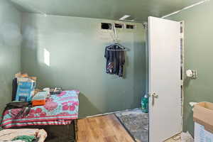 Bathroom with wood finished floors and a sink