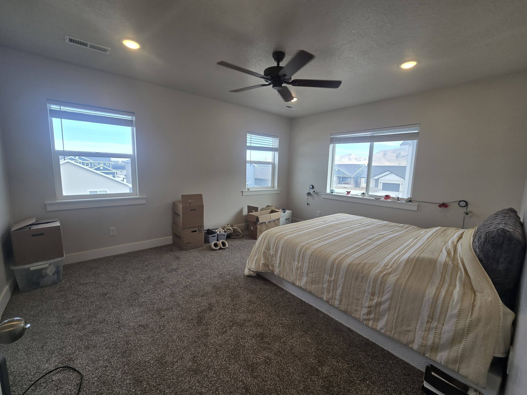 Bedroom with carpet floors, a ceiling fan, and recessed lighting