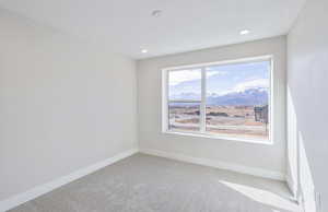 Bedroom 4 with carpet and a mountain view
