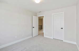 Bedroom 3 featuring carpet floors and baseboards
