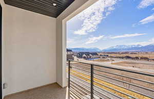 Balcony with a mountain view and a residential view