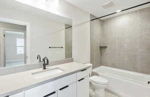 Full bath featuring vanity and shower / tub combination