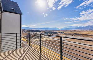 Owner's Suite balcony with a mountain view and a residential view