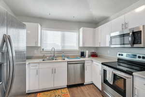 Classic white kitchen with stainless steel appliances