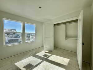 Unfurnished bedroom with a closet