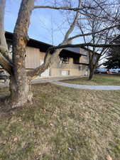 View of front facade featuring brick siding and a front lawn
