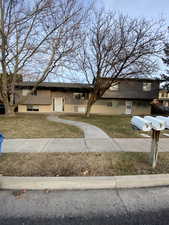 Bi-level home with a front lawn