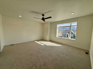 Unfurnished room with recessed lighting, carpet, a textured ceiling, and ceiling fan