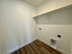 Laundry room featuring dark wood finished floors, washer hookup, and electric dryer hookup