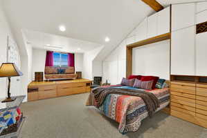 Carpeted room featuring a built-in platform with integrated storage, a window with natural light, and recessed lighting