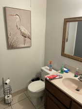 Bathroom with vanity and light tile patterned floors