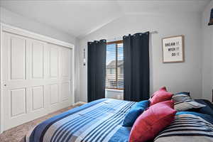 Bedroom with carpet and a closet