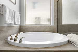 Full bathroom with a bath