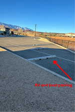 View of parking with a mountain view