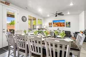 Dining room featuring tile patterned floors, a ceiling fan, and recessed lighting