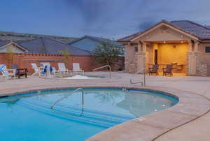 Community pool featuring a patio area and a hot tub