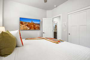 Bedroom featuring a ceiling fan and a closet