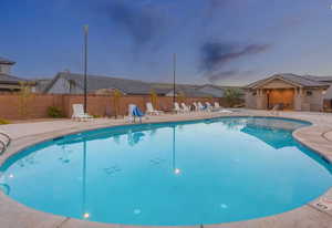 Community pool with a patio