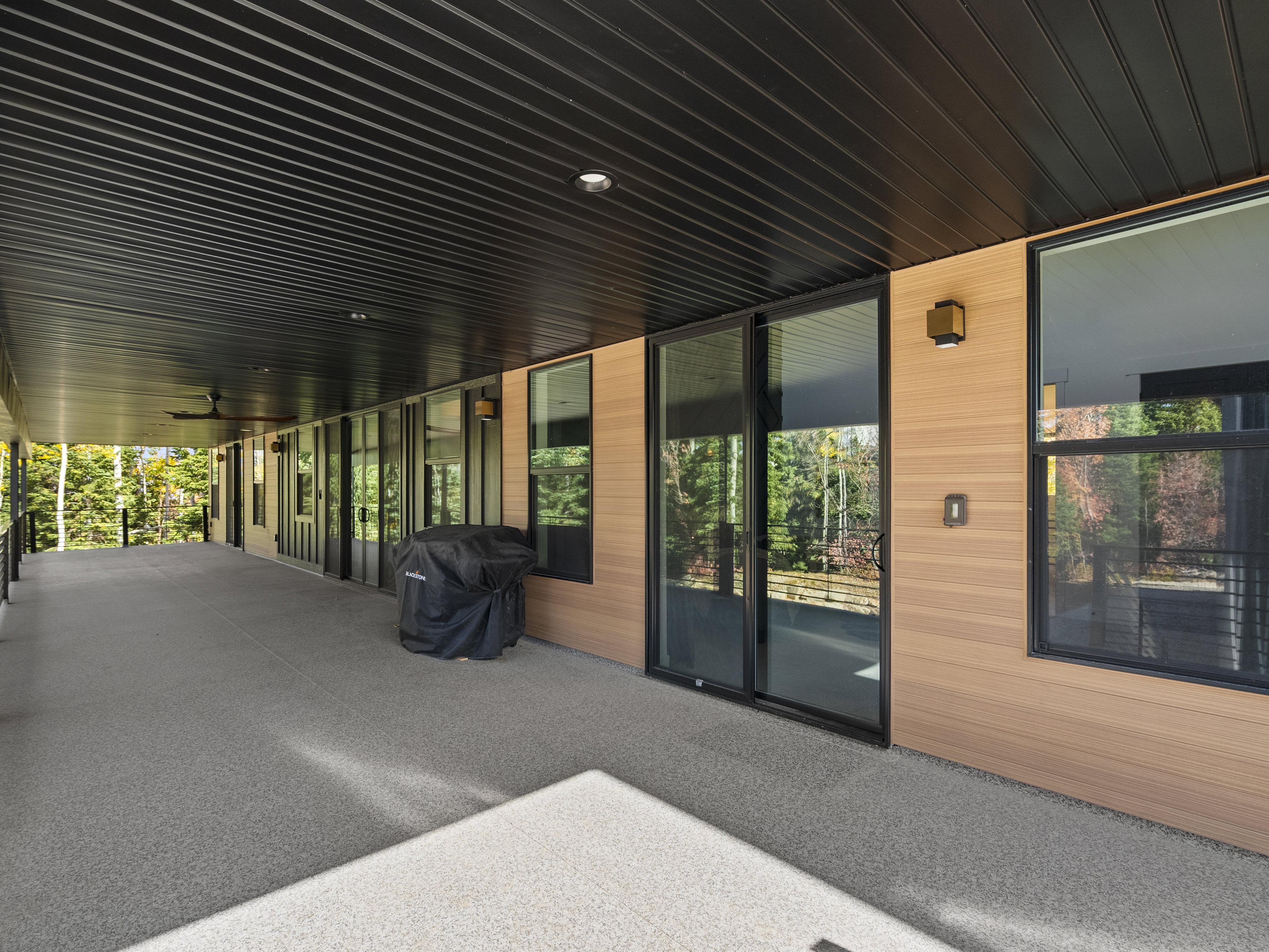 View of deck featuring a grill and ceiling fan