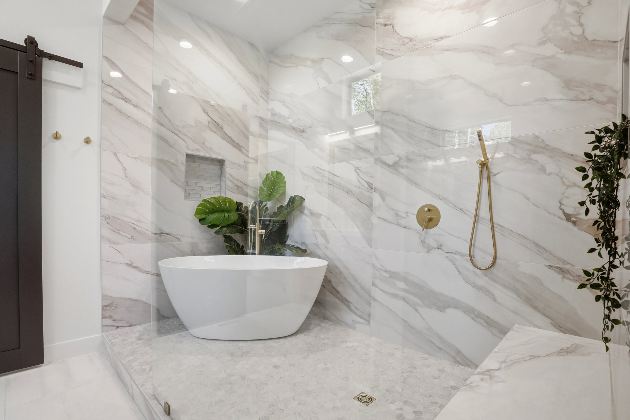 Spacious walk-in shower featuring large-format wall tiles