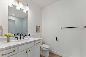 Bathroom with vanity and light wood finished floors